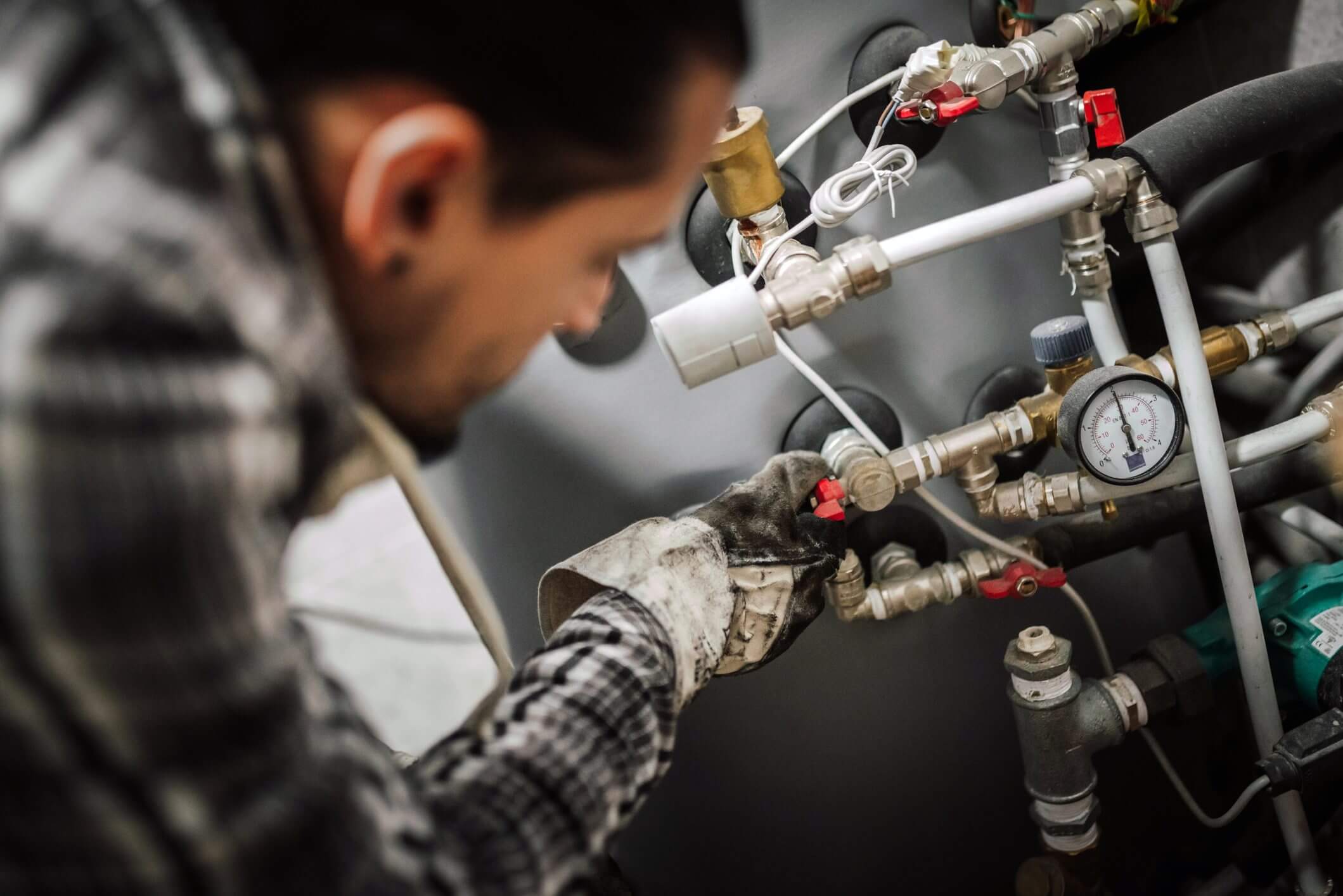 Worker repairing industrial equipment