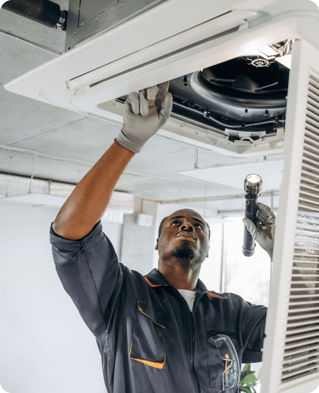 Man repairing ceiling AC unit