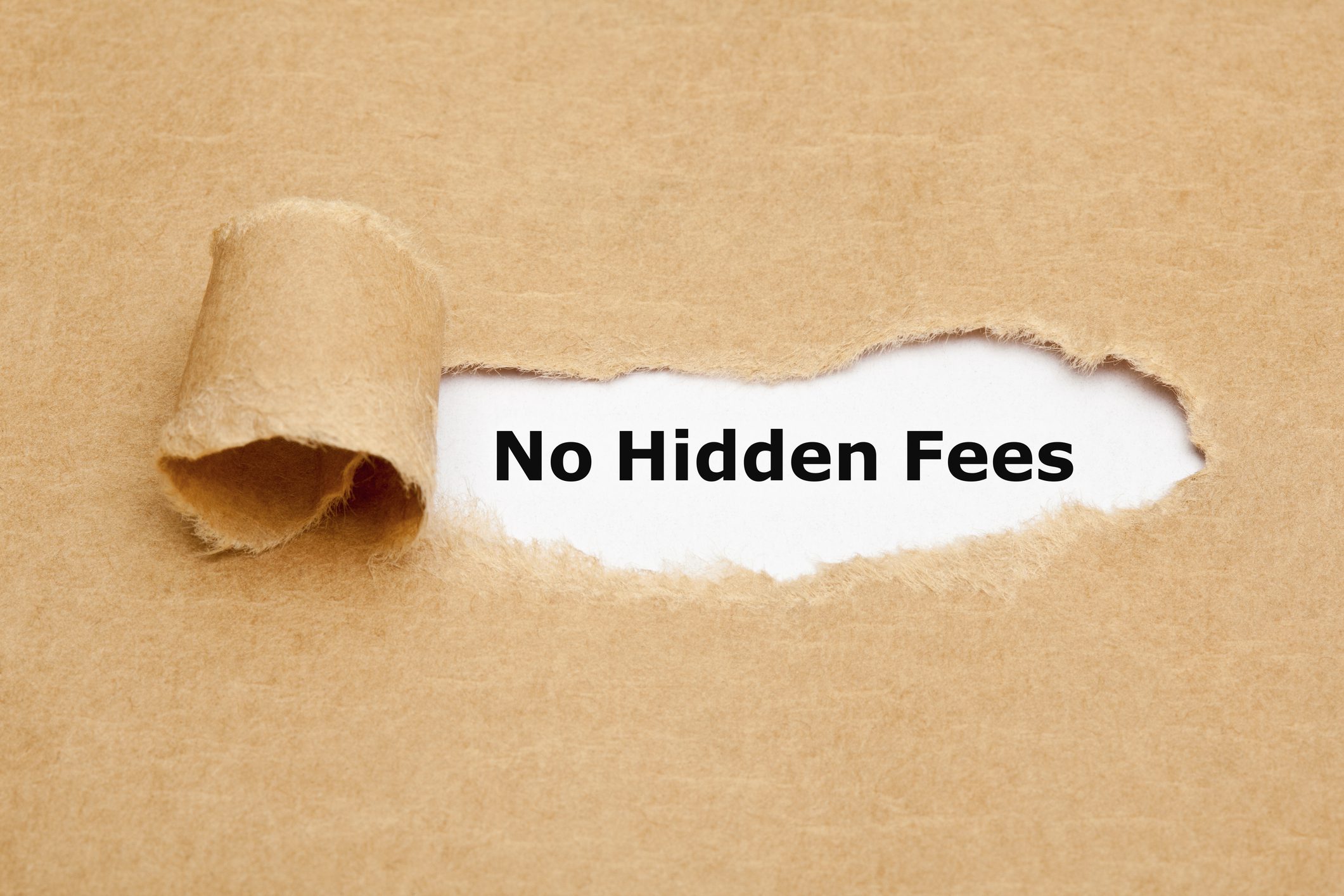 Torn paper revealing 'No Hidden Fees' message.