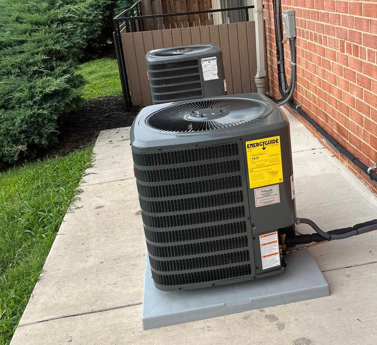 HVAC Contractor in Eastport MD (1) Two HVAC units installed by the HVAC contractor in Eastport, MD, outside a residential building.