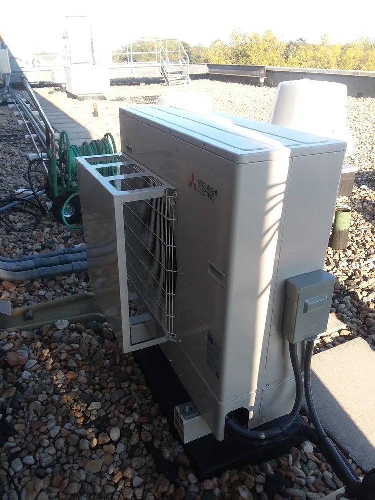 HVAC Contractor in Eastport MD 2 Mitsubishi Electric HVAC unit installed by the HVAC contractor in Eastport, MD, on a rooftop with electrical components.