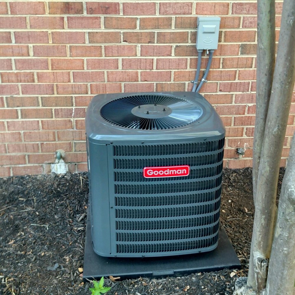 HVAC Contractor in West Annapolis MD 2 Goodman HVAC unit installed by the HVAC contractor in West Annapolis, MD, on a concrete pad next to a brick wall.