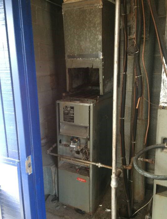 Old and new furnace systems shown during professional furnace installation service in Edgewater MD.