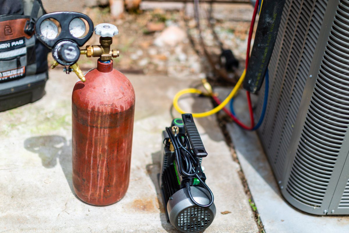 HVAC contractor performing AC repair and refrigerant service in Riva MD