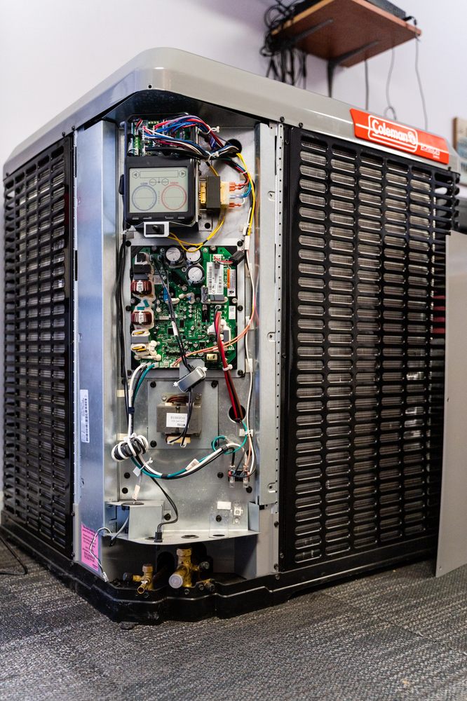 Professional HVAC contractor repairing heating and cooling system in West Annapolis MD