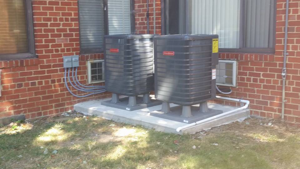 Goodman heat pump installation on concrete pad in Edgewater MD