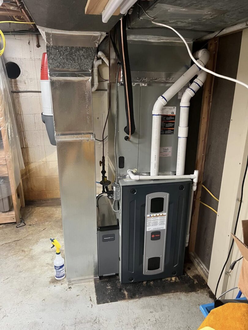 Modern high-efficiency Trane furnace and air handler installation in an Annapolis, MD home basement.