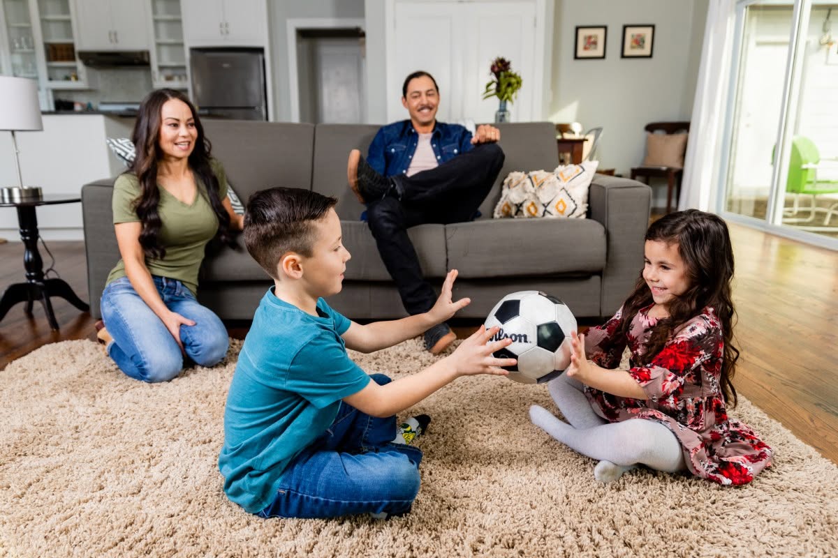 Family enjoying a warm and comfortable living room temperature in an Annapolis, MD home.
